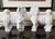 A striking pair of mid-century modern 'Blanc de Chine' white porcelain standing guardian lion (Foo Dog) statues,...