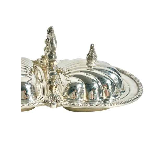 Charming vintage silver plate serving dish with two shell form lids that are removable. Perfect for serving caviar, olives...