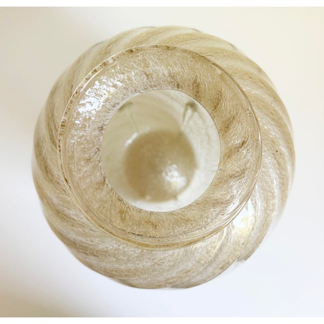 We present this large-scale 14" high by 10" diameter vintage handblown art glass vase featuring a distinctive aventurine...