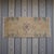 This exquisite hand-knotted Oushak mat brings a touch of mid-century Anatolian charm to any small corner of your home. Its...