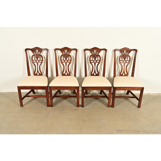 A gorgeous set of four Georgian or Chippendale style dining chairs By Henredon USA, Circa 1980s Carved mahogany frames,...