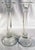 A dramatic pair of monumental hand-crafted clear glass candlesticks, distinguished by their extraordinary scale,...