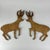 A lovely vintage pair of wood cutout and painted dears in a prancing pose. They are both facing each other. A pair full of...