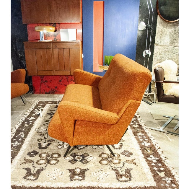 Sofa with iron legs, brass feet and fabric. Italian production from the 50s.