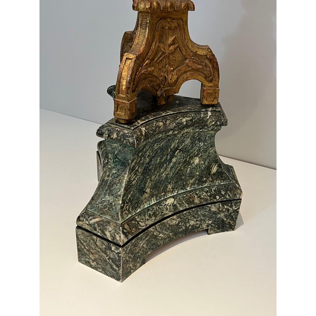 This decorative tall candelabra is made of a gilded carved wood on a patinated base. This is a French work. Circa 1900