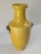 We are selling this Chinese yellow glazed vase. This vase has Sancai style glaze with yellow glaze, aubergine purple and...