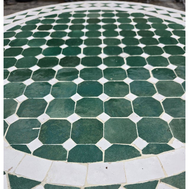 100 % glazed round. Green and white Moroccan mosaic table measuring approximately 24" in diameter and 29" in height. For...