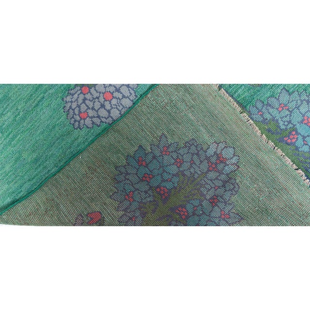 This exceptional antique Irish rug fragment, attributed to the celebrated designer C.F.A. Voysey, represents the essence...