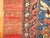 Traditional room size Persian Bidjar rug with a large navy medallion on a soft brick red field and mustard color corner...