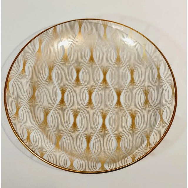 Vintage gold glass dish plate. Made by Svend Jensen out of Denmark, out of New York in the 1950s. This shallow dish is...
