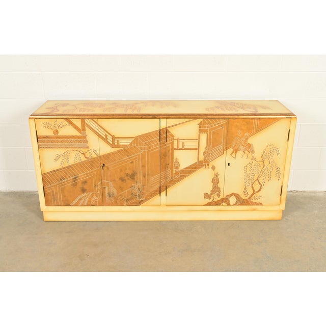 An exceptional mid-century Hollywood Regency Chinoiserie sideboard, credenza, or bar cabinet In the manner of Baker...