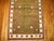 A fascinating small Turkish rug featuring a planted flower tree surrounded by a thin ivory border with small square-shaped...