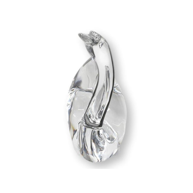 This Baccarat crystal swan figure dates to the 1980s and features the brands signature clarity and fluid sculptural form....