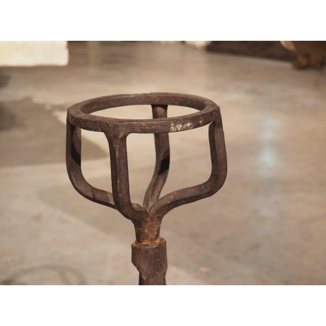 These antique French “chenets” are from the 1700s and have been hand-wrought in iron. Their uppermost portions were...
