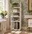 A wonderfully useful late 19th-century American Victorian bamboo étagère, retaining an old white painted finish with the...