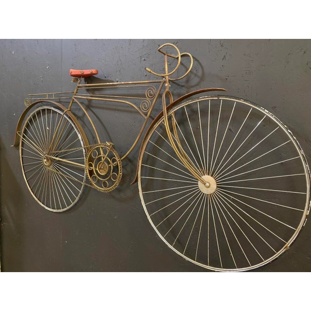 Large Curtis Jere Wall Sculpture, Moving Bicycle. With minimalist wire accents and a a painted red wooden seat,this...