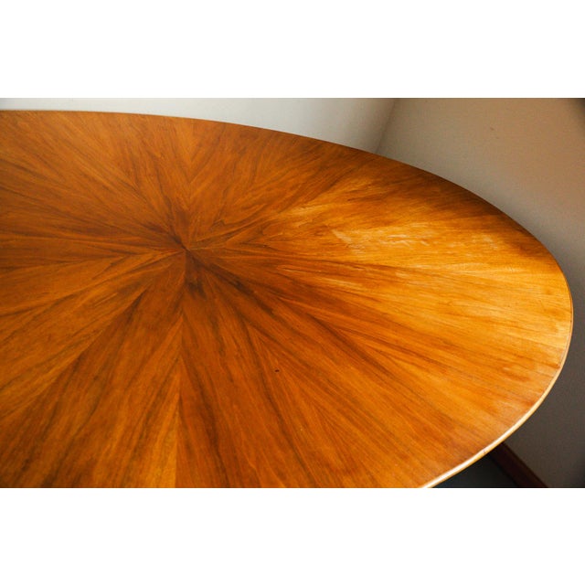 Osvaldo Borsani for Stow & Davis Mid Century starburst walnut and steel oval dining table Mid 20th Century. Walnut...