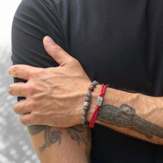 Embrace protection and style with the Men's Sterling Silver Evil Eye Charm Red Rope Hope Bracelet. This distinctive...