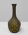 20th Century Belgian ceramic vase with ornate details. This sculptural ceramic vase features a richly textured surface and...