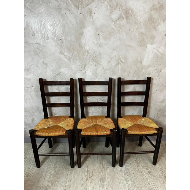 An elegant set of six solid wood chairs, dating from the 1960s, in the style of French designer Georges Robert. These...
