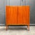 Product. Small highboard. Style. Mid-century, 1960s. Material. Mahogany veneer, partially solid wood. Features. Two doors,...