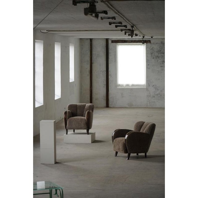 An elegant pair of Danish Art Deco lounge chairs from the 1940s, crafted by a skilled Danish cabinetmaker. These rare...