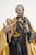 Antique sculpture depicting Saint Joseph with Child resting on a gilded wooden base of the same period. The sculpture...