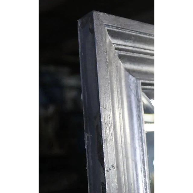 Vintage, late 20th century large beveled glass mirror. Moulded frame with silver giltwood style finish.