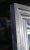 Vintage, late 20th century large beveled glass mirror. Moulded frame with silver giltwood style finish.