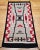 Discover the beauty and craftsmanship of this authentic vintage Navajo style rug, handwoven in the Southwestern United...