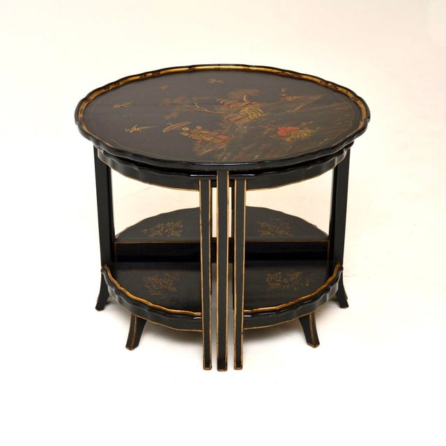 A beautiful and extremely well made antique lacquered Chinoiserie nesting coffee table. This was made in England, it dates...