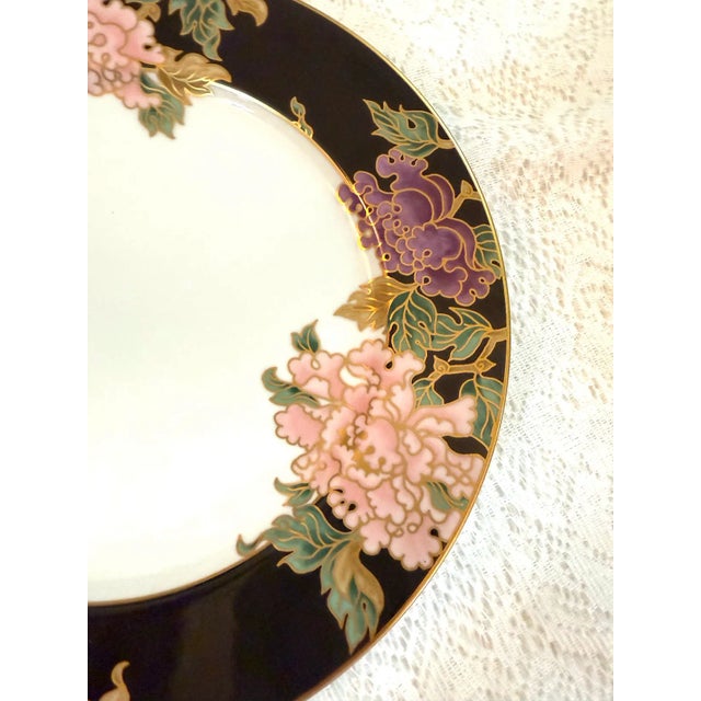 The "Cloisonné Peony Black" dinnerware collection is one of their famous products that features black rim and peony floral...