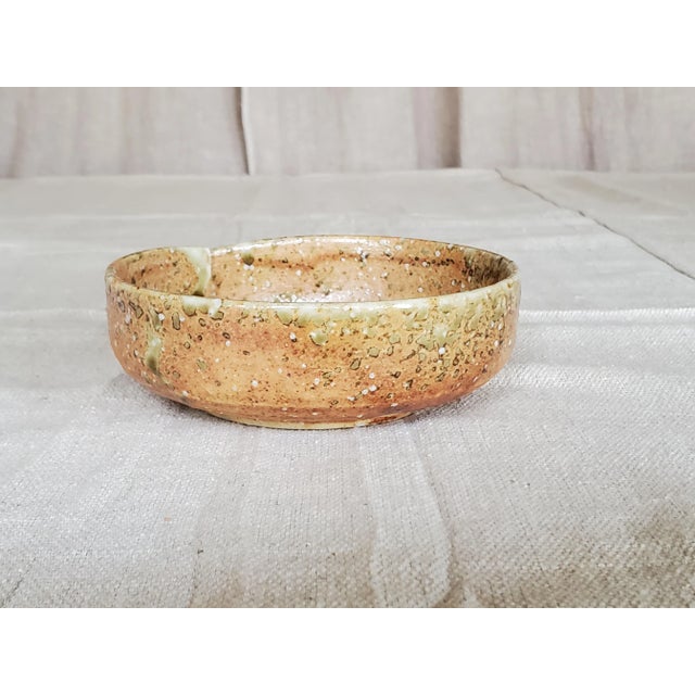 This is a beautiful little decorative bowl. It's an unsigned studio pottery piece in excellent condition.