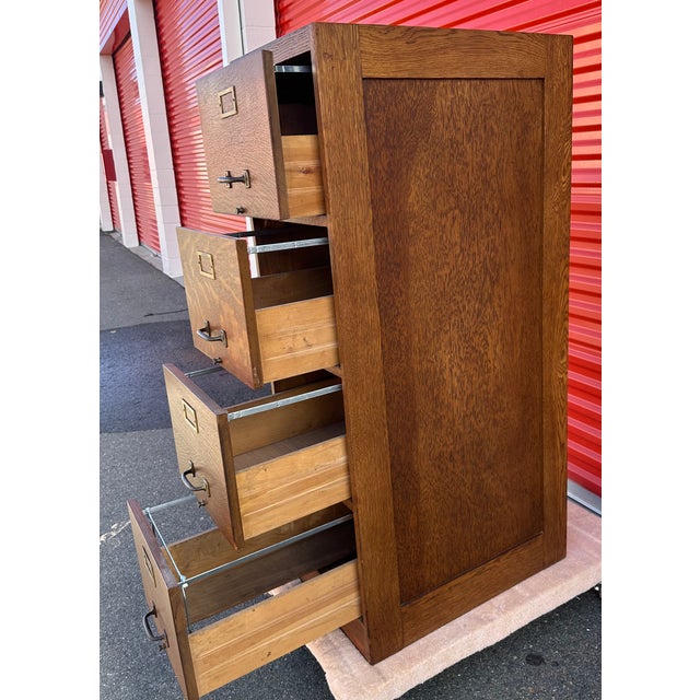 Filing cabinets, particularly those made from solid wood like oak, became increasingly common in offices and libraries...