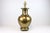 This substantial vintage brass lamp features graceful curves and a weighty presence, making it a beautiful statement on a...