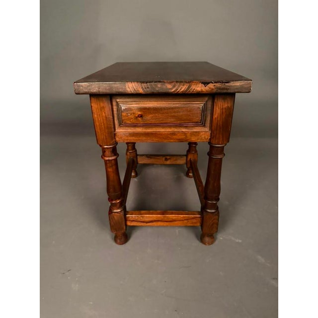 Pair of American Country English pine side tables, circa 1920s, featuring a warm walnut finish and timeless craftsmanship....