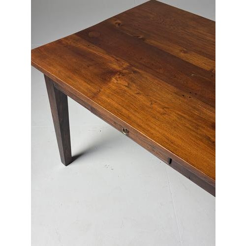Classic farmhouse dining table in country style. Late 20th century. Made of solid teak. In very good condition. With two...