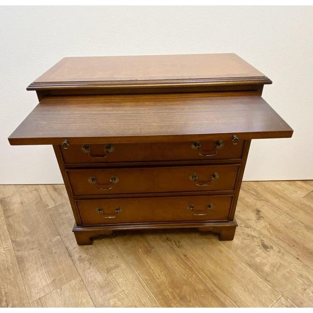 You are viewing a pair of Georgian Revival bachelor's chests in walnut Classic bachelor chest with the pull out slide at...