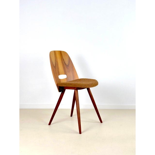 Iconic dining chairs designed by Frantisek Jirak into a shape resembling a lollipop. Produced by Tatra Nábytok in former...