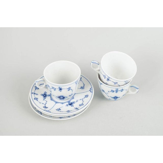 Royal Copenhagen Blue Fluted Plain, set of three coffee cups with saucers. Three coffee cups with matching saucers in...