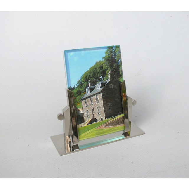 A small picture frame, crafted in the strict Art Deco style, made in France. The picture frame is of high quality and...