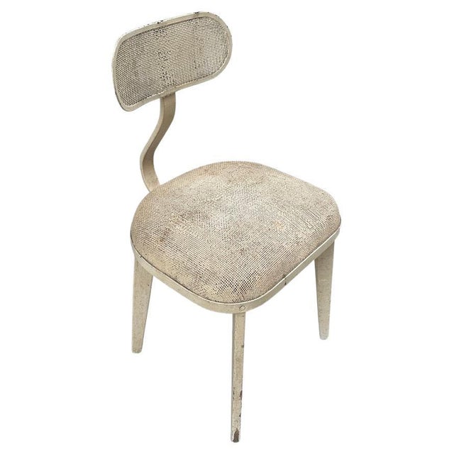 A beautiful silhouette on this antique perforated metal chair. The legs are wood. Full dimensions; Seat 15″ deep x 17″...