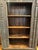 This reclaimed hand-crafted carved wood Indian bookcase is repurposed from authentic antique architectural elements. It...