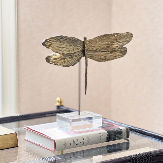 Mix it up. With gilded wings textured by hand, this dragonfly accessory makes a spot more playful. Orchestrate your space...