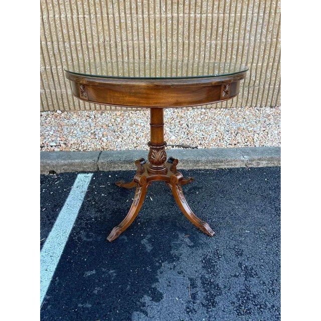 Vintage Regency Style Mahogany Carved Round Table with Glass Top. Solid wood, carved details Sturdy Approximate measures:...