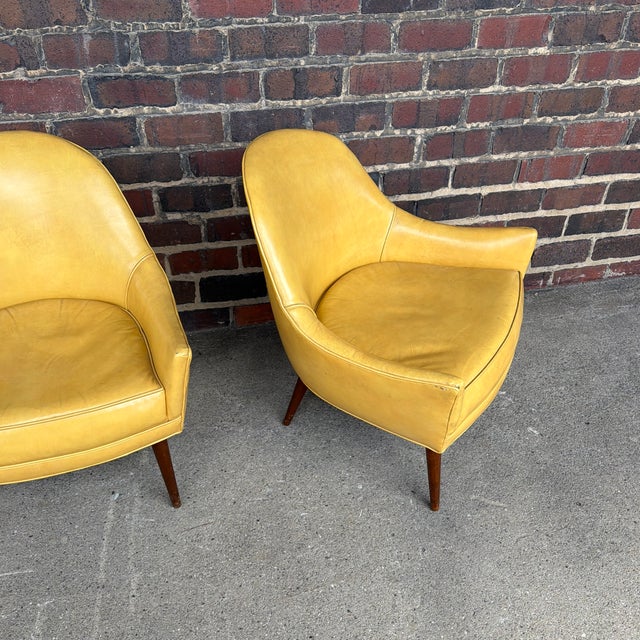 Offered is a pair of original Paul McCobb lounge chairs featuring the clean, sculptural lines that have made his designs...