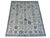 Allover angular floral design with staggered rows of palmettes, rosettes and serrated leaves joined by a fine vine...