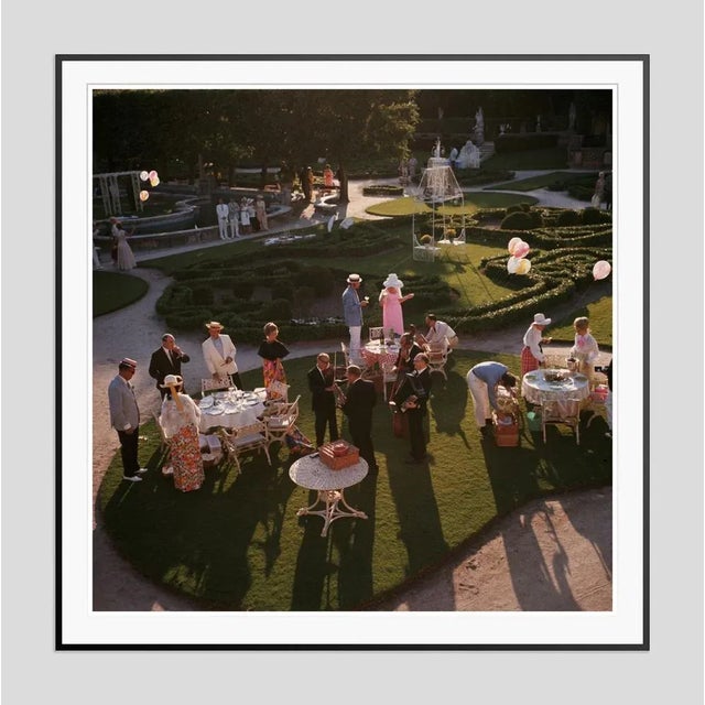 Garden Party' by Slim Aarons Open Edition 1970: An elegant garden party in Miami, Florida. (Photo by Slim Aarons). An...