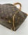 Louis Vuitton Monogram Tivoli GM in very good condition. Signature monogram canvas exterior trimmed with tan leather and...