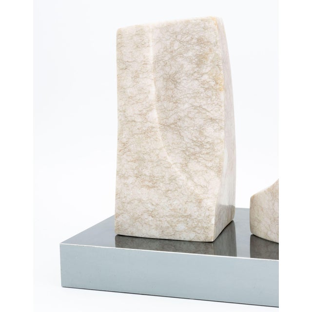 Modernist Abstract Marble Sculpture, 1971, comprised of two beige marble pieces mounted on a mirrored base, signed and...